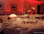 red mood lighting behind top table